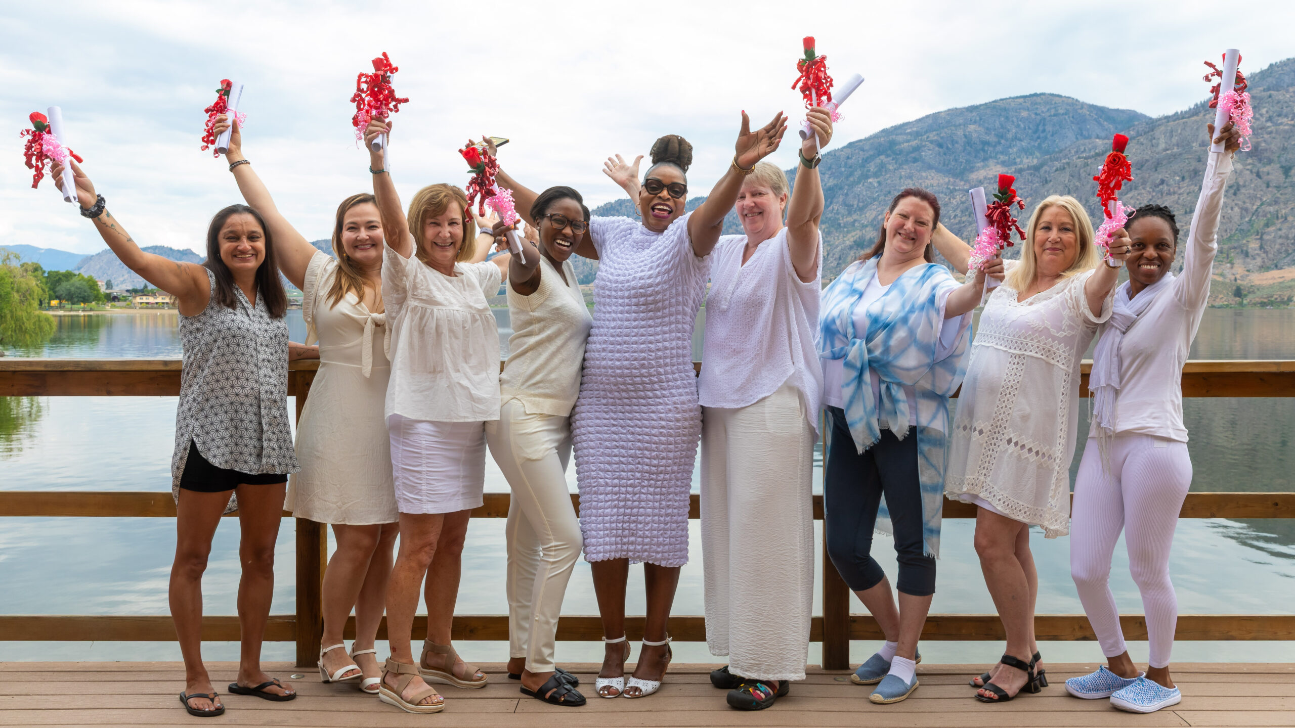 RETREAT GRADUATE RAISING HANDS